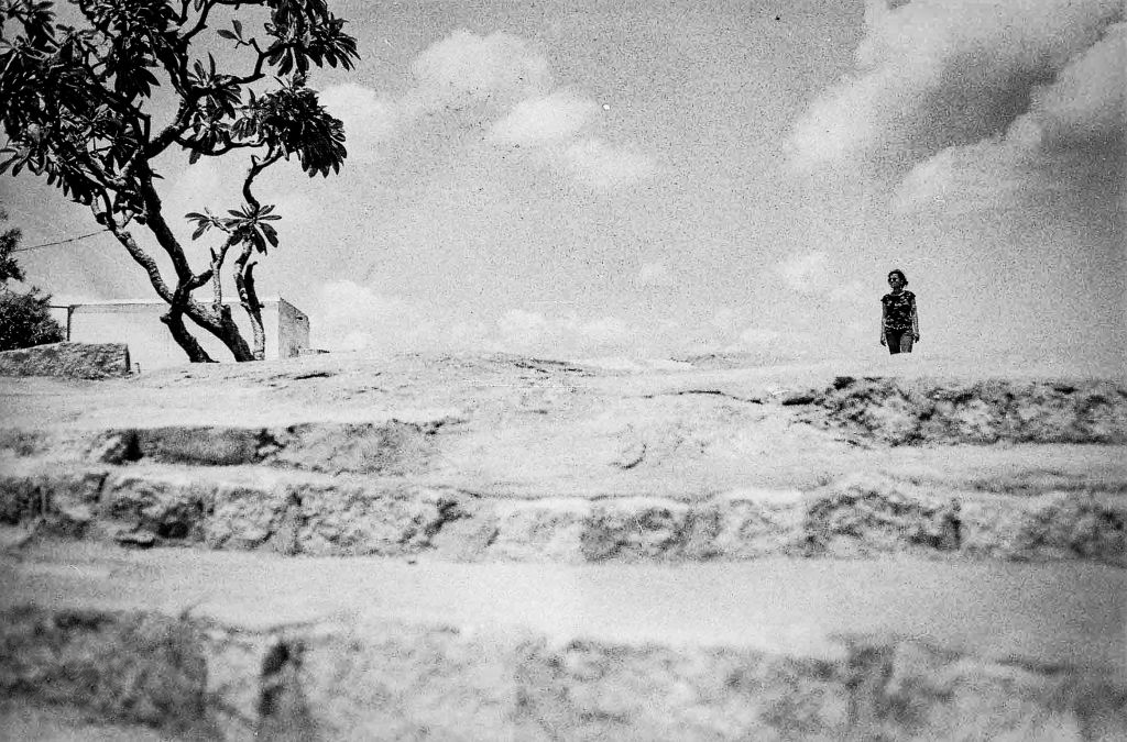 Lone figure on stepped rocks