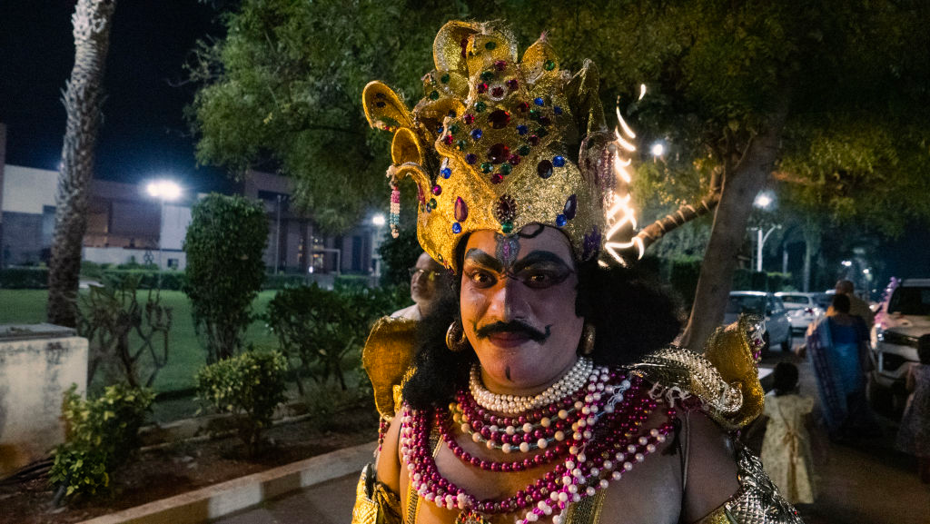 Costumed performer at night