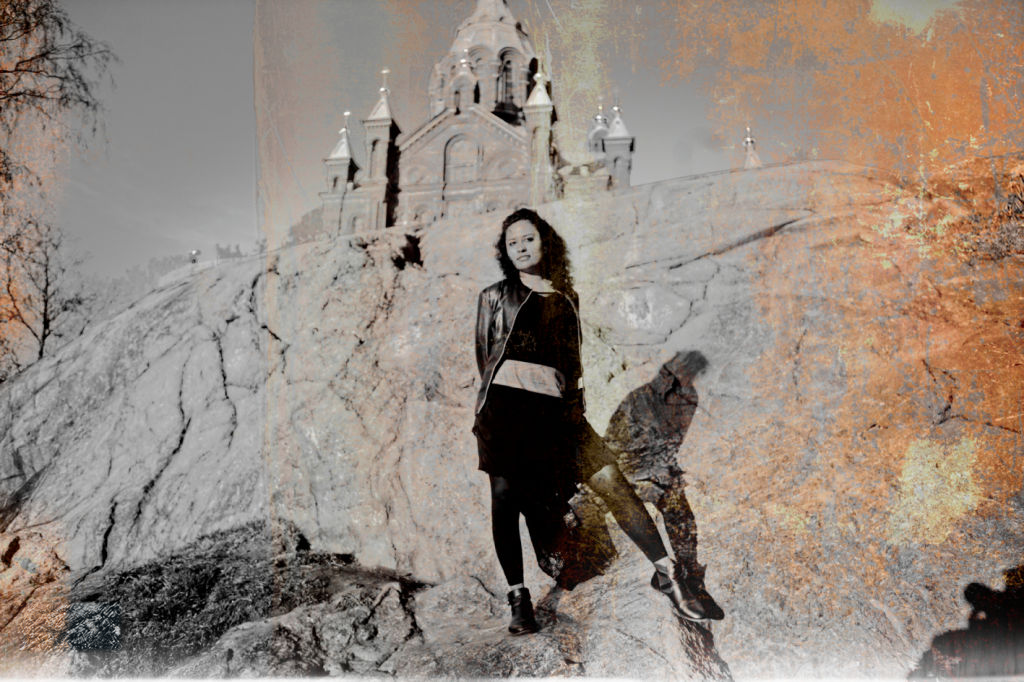 Woman against a rock face