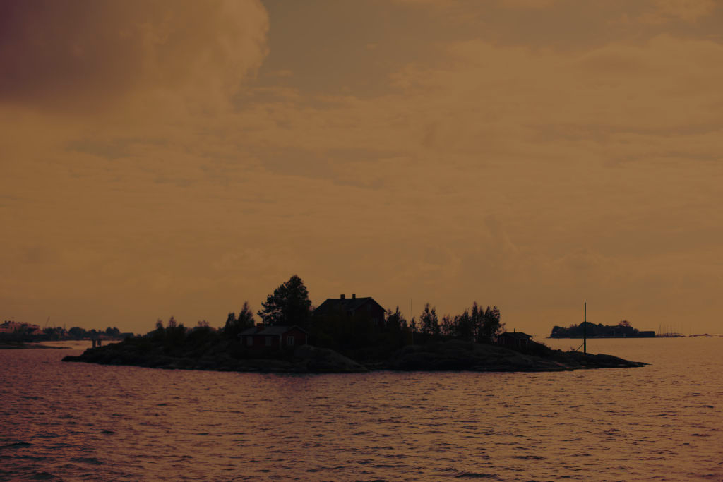 Island silhouetted across water